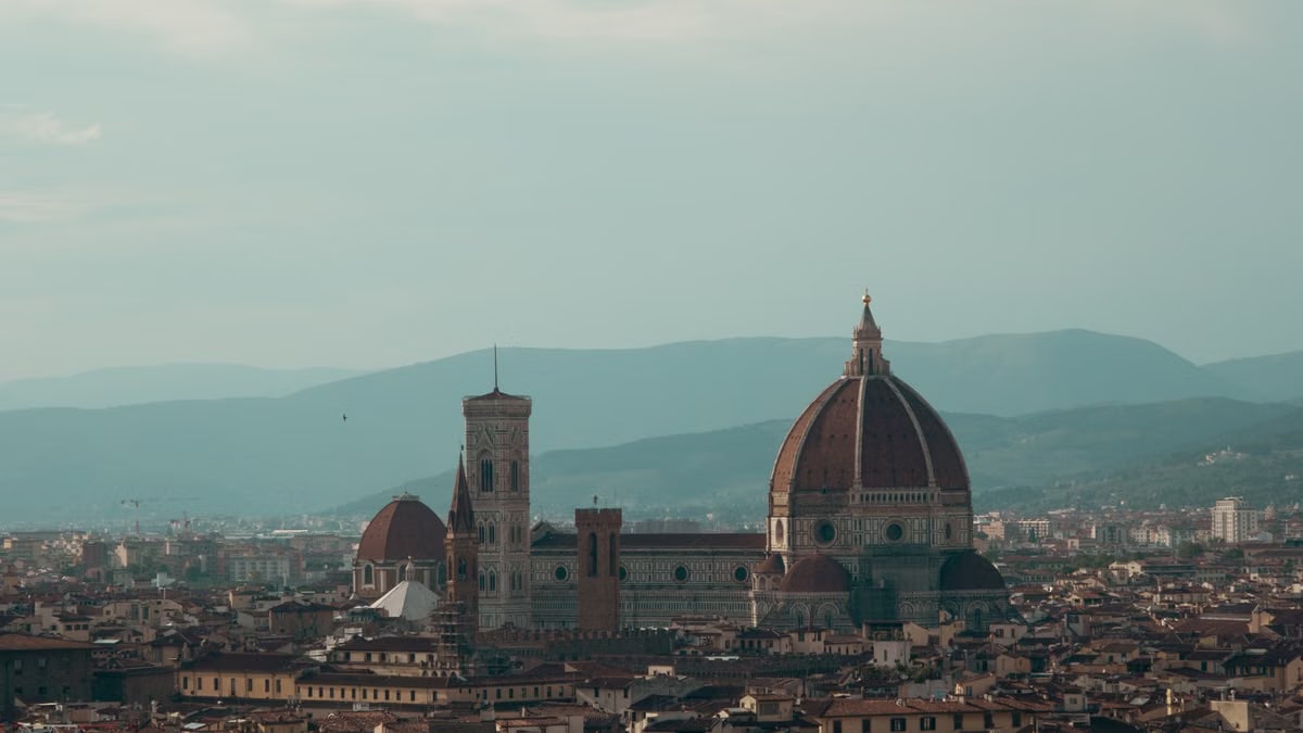 Explore the breathtaking aerial view of Florence featuring the iconic Cathedral of Santa Maria del Fiore.